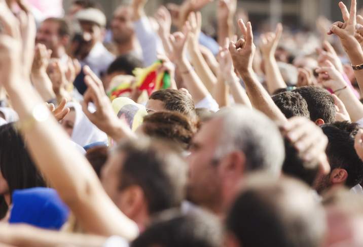 hands offering peace sign